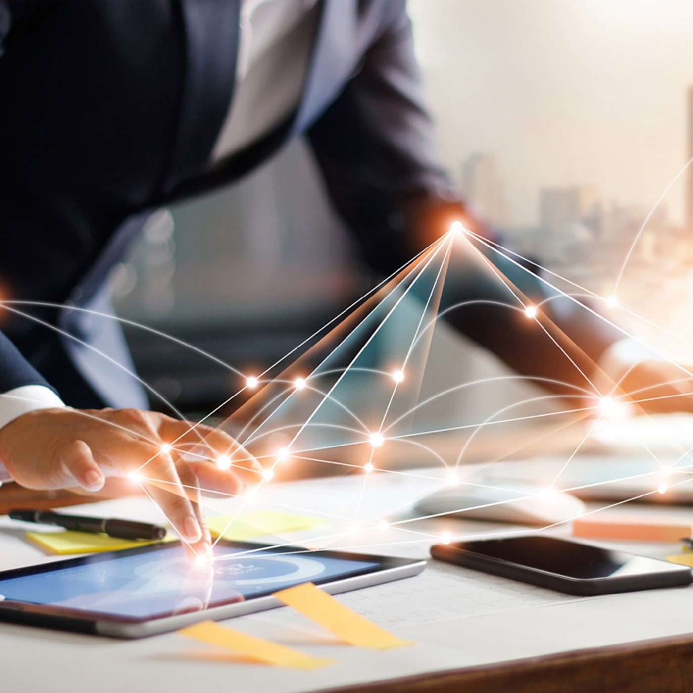 A business professional engages with a digital tablet, illustrating concepts of network connectivity and data analysis, highlighting the integration of technology in modern corporate strategies.